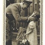 Adolf Hitler greeting a young girl holding flowers
