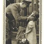 Adolf Hitler greeting a young girl holding flowers