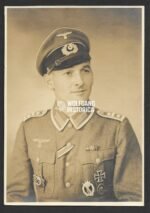 Portrait of Wehrmacht Oberfeldwebel wearing Deutsches Kreuz in Gold