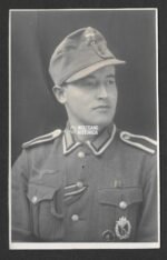 Studioportrait Wehrmacht Soldier wearing Feldmütze Awards (IAB, VWA)