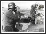 German Press Photo: Wehrmacht Artillery Forward Observer in a Foxhole