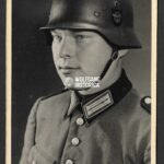 Studioportrait of Polizei Officer wearing M35 Police Helmet with decal!