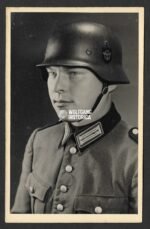 Studioportrait of Polizei Officer wearing M35 Police Helmet with decal!