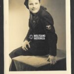 Studioportrait of young girl with the Reichspost