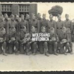 Waffen-SS Groupphoto of soldiers holding their SS Helmet!