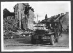 German Press Photo – Supply Convoy through the Ruins of Normandy, July 1944