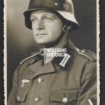 Studioportrait Wehrmacht Soldier wearing helmet (with decal)