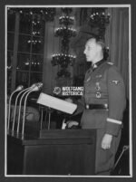 Press Photo: SS-Obergruppenführer Reinhard Heydrich speaking at a Conference