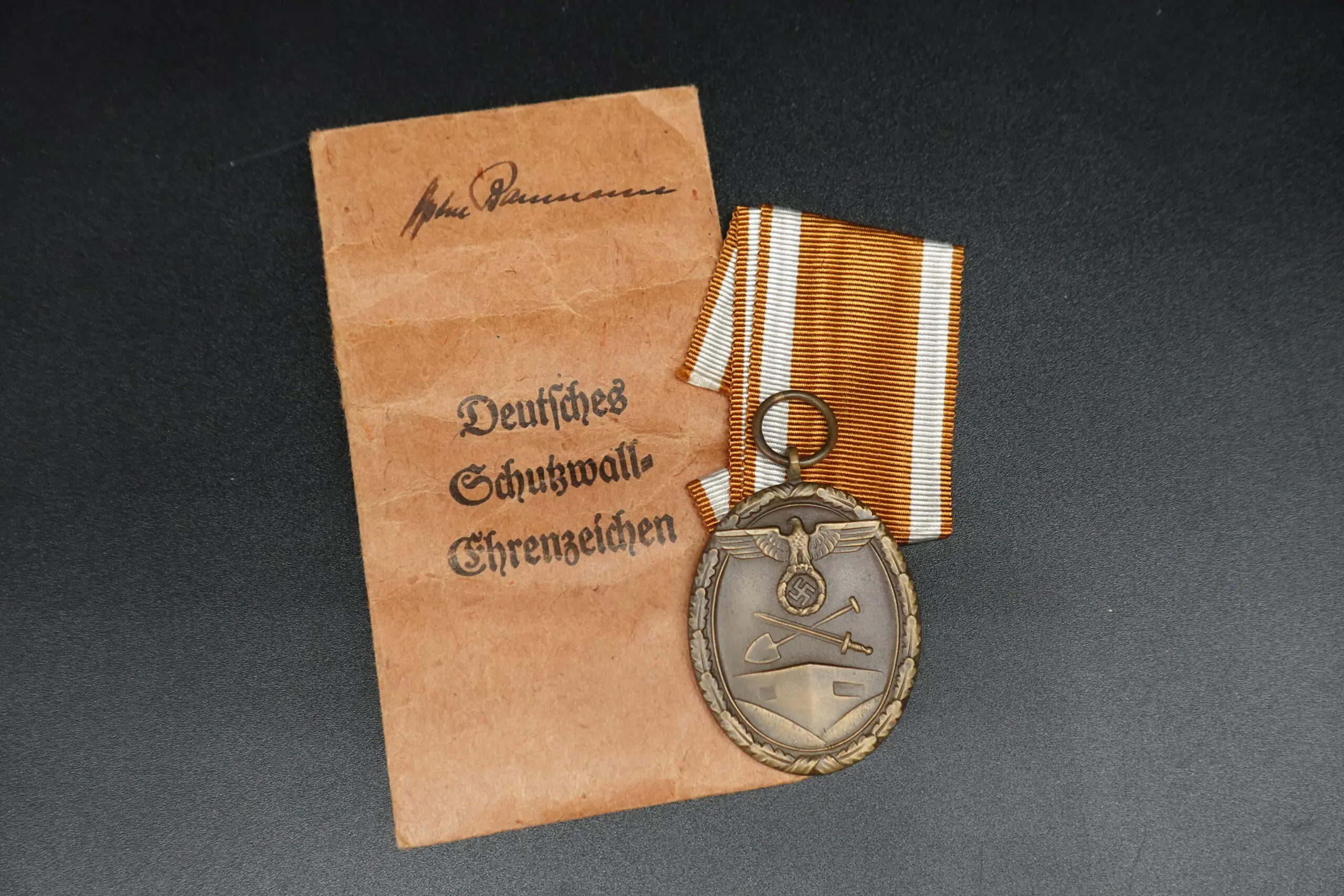 Deutsches Schutzwall-Ehrenzeichen (“Westwall Medal”) with Carl Poelath Pouch - Image 1