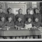 Rare Waffen-SS Group Photograph with "Das Schwarze Korps" Newspaper & "Meine Ehre heißt Treue" Motto